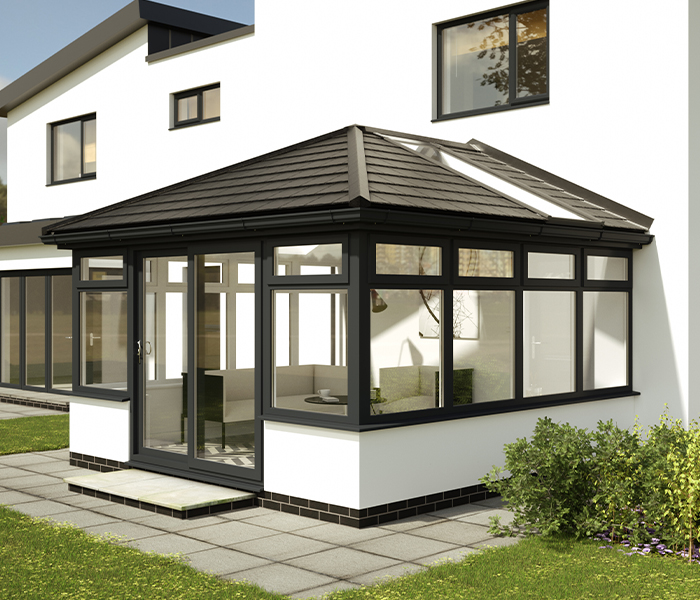 Modern conservatory with Equinox tiled roof system for improved energy efficiency and year-round comfort.